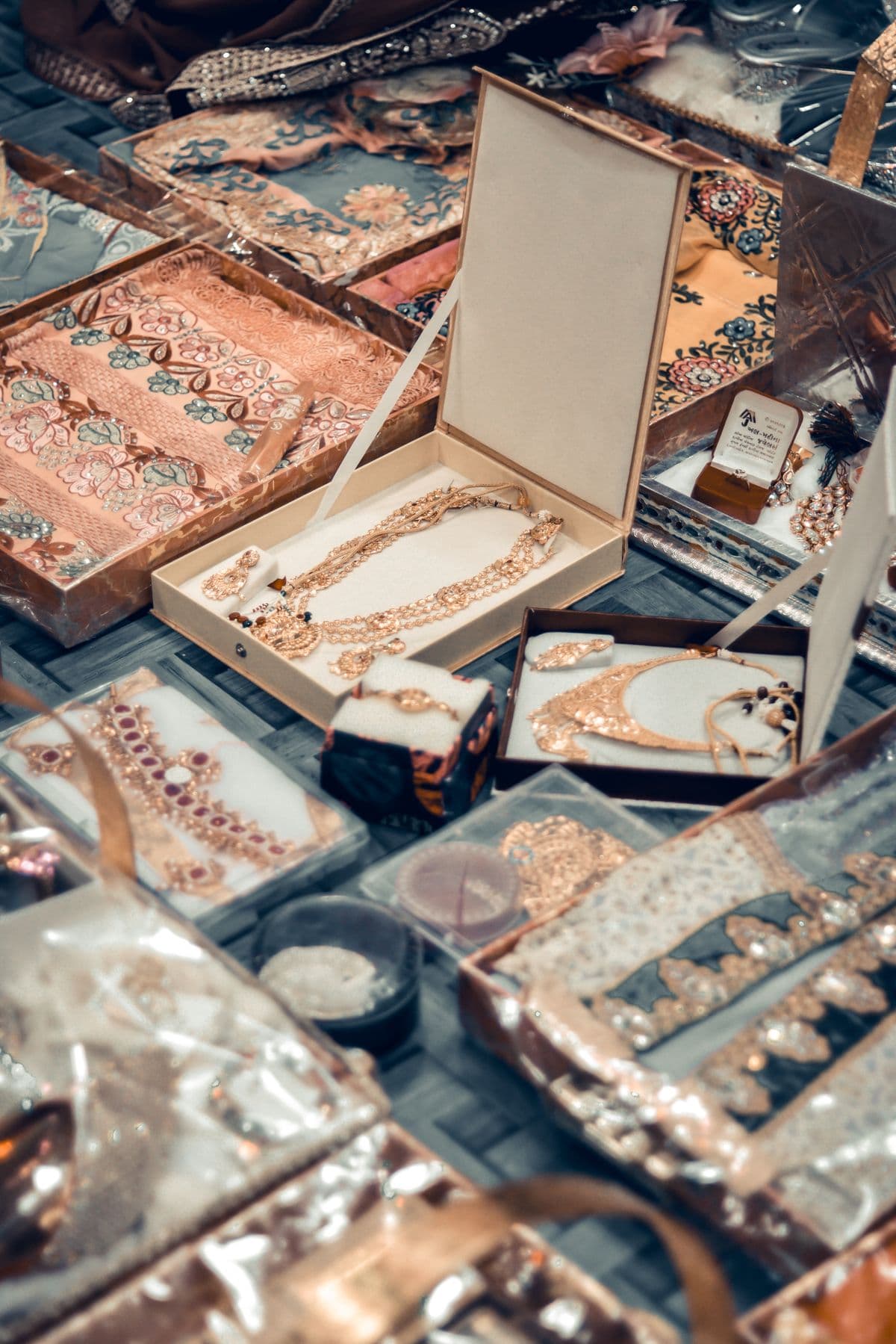 Rose gold Indian jewelry arranged in presentation boxes